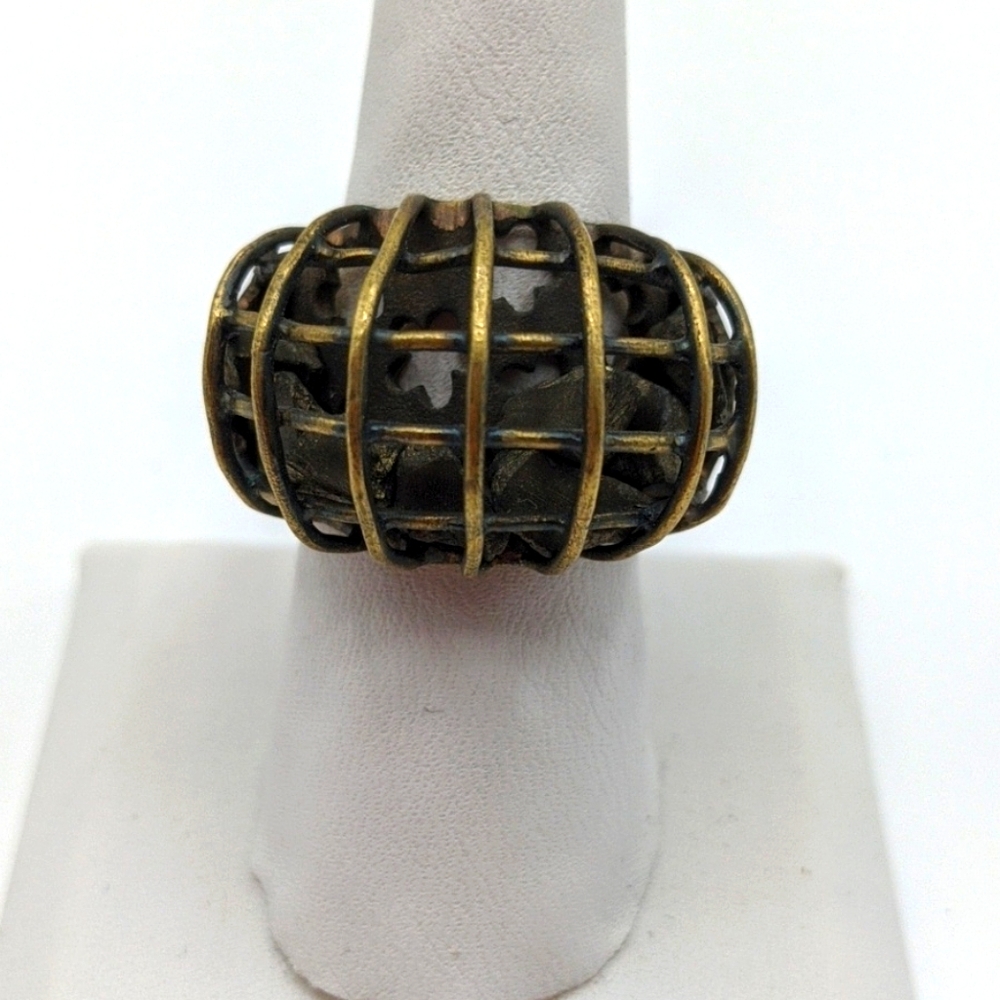 Modernist ring with loose black stones